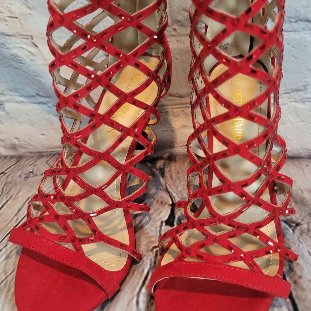 Never worn beautiful sparkling red gorgeous unique heeled sandles.